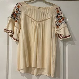 Cream tunic with embroidered floral details